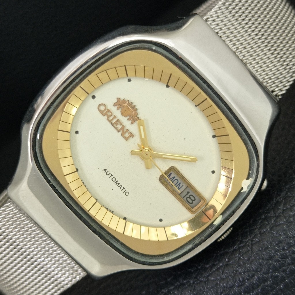 Vintage 1974 Orient Automatic Mens Silver Watch WDaydate  Gold Accents